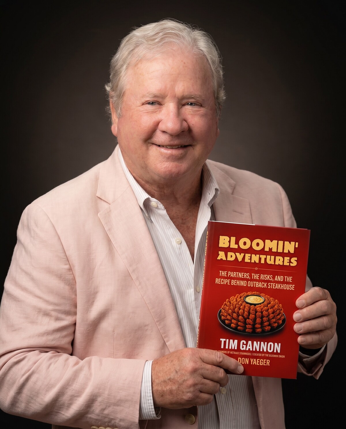 Tim Gannon holding Bloomin' Adventures