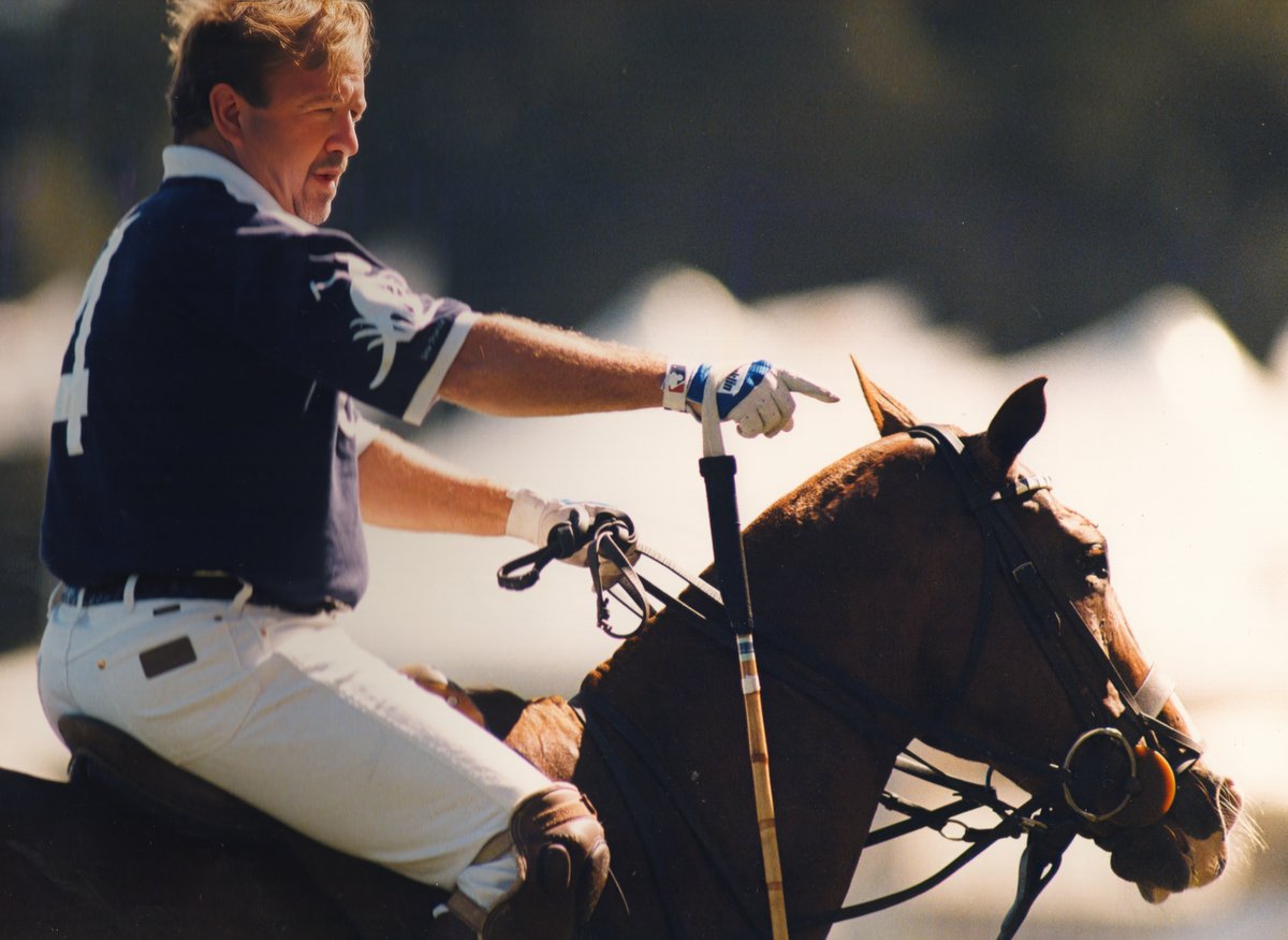 On horseback.