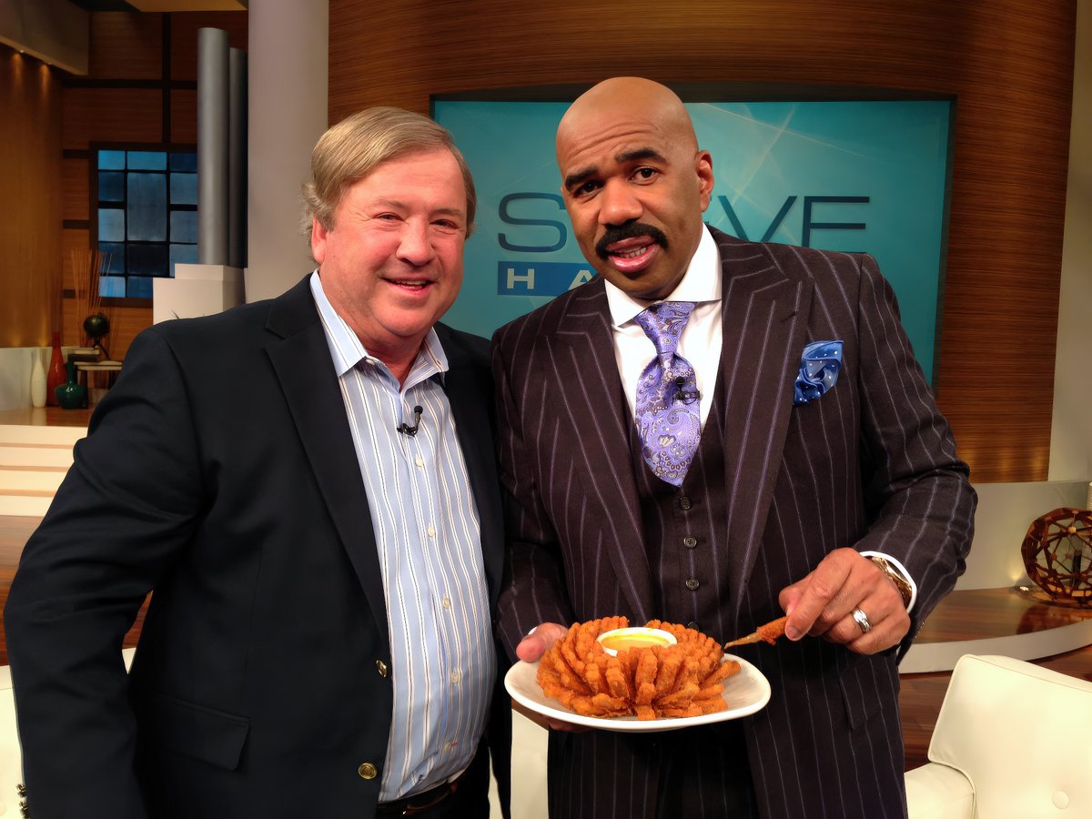 With Steve Harvey and a Bloomin' Onion.
