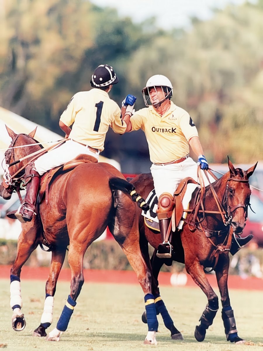 Fist bump on horseback after a play.