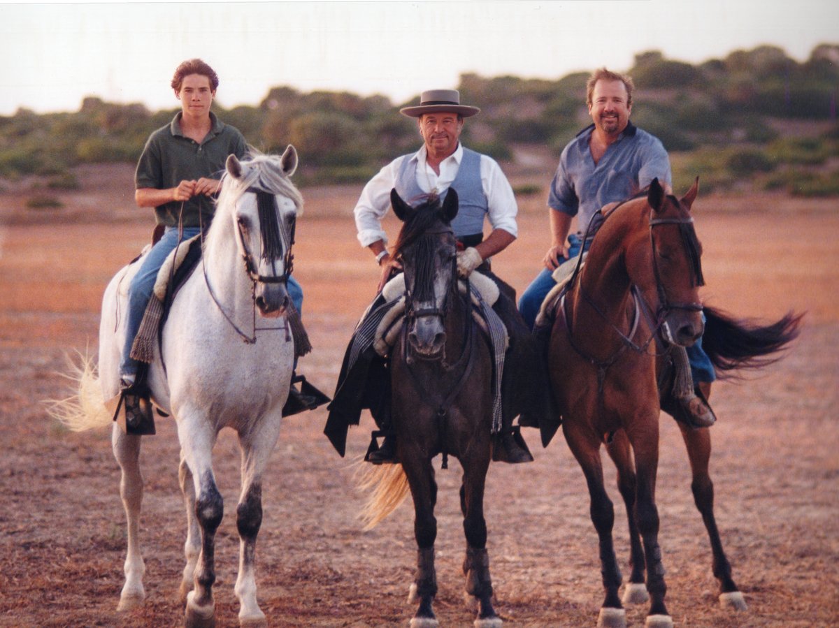 Chris Gannon, Alvaro Domecq Romero, and Tim Gannon on horseback in Spain.