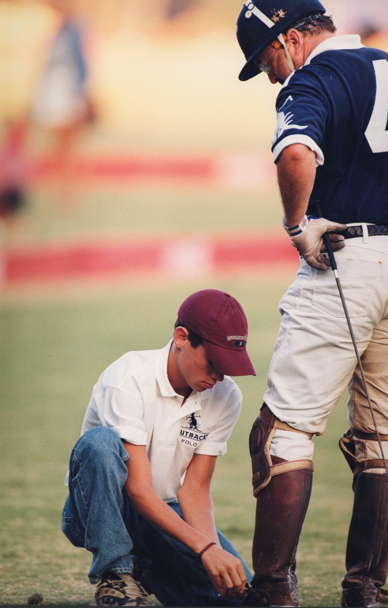 Chris helping with riding boots before a match.