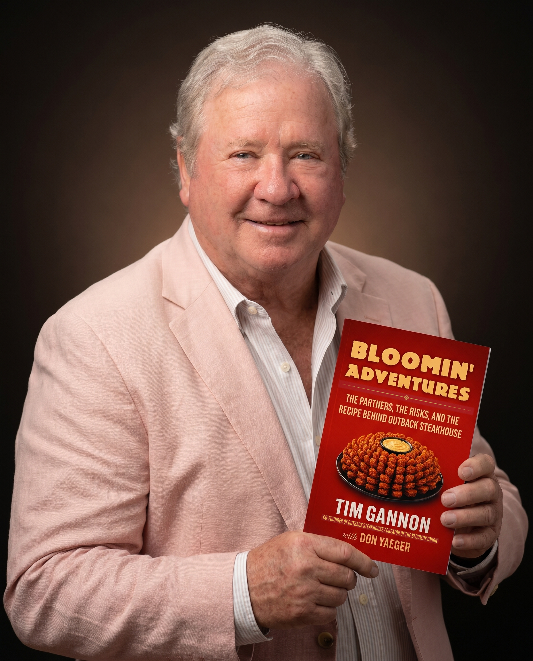 Tim Gannon studio portrait holding Bloomin' Adventures
